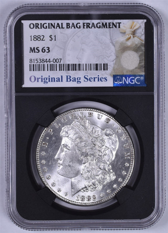 1882 Morgan Silver Dollar - NGC MS63 - Original Relic Bag Label Stock Photos