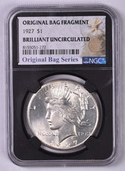 1927 Peace Silver Dollar - NGC Brilliant UNC Relic Bag Label Stock Photos